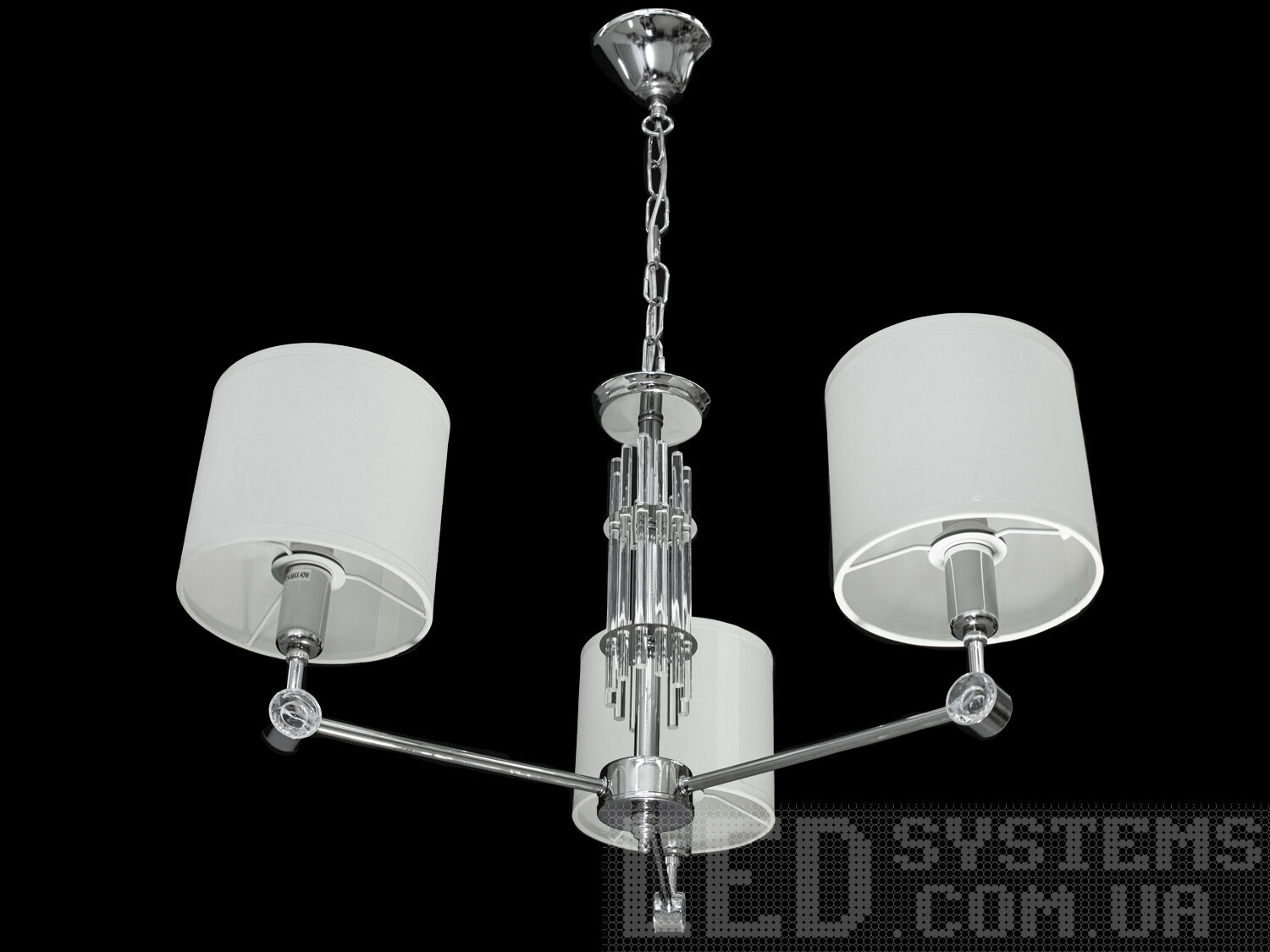 Невелика люстра для коридору з абажурами в класичному стилі з витонченою металевою основою та стильними кришталевими елементами. Ви можете вибирати виконання металевих частин у золотому або хромованому варіанті. Застосовується для вітальні, залу, холу, спальні. У цій серії люстр і бра ідеально переплелися такі поняття, як солідність, строгість і простота.
Люстри та бра цієї моделі під звичайні лампи розжарювання або &laquo;LED-економки&raquo; на патрон Е14 внесуть класичні нотки до Вашого інтер'єру та дозволять підібрати потрібну вам температуру світіння.Універсальним кріпленням на планку легко кріпляться на будь-який тип стелі (підвісний, натяжний, звичайний). Увімкнення/вимкнення відбувається з настінного вимикача.