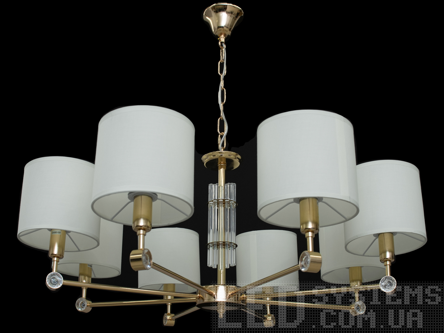 Сучасна люстра на 8 ламп у вітальню з абажурами, з витонченою металевою основою та стильними кришталевими елементами. Ви можете вибирати виконання металевих частин у золотому або хромованому варіанті. Застосовується для вітальні, залу, холу, спальні. У цій серії люстр і бра ідеально переплелися такі поняття, як солідність, строгість і простота.
Люстри та бра цієї моделі під звичайні лампи розжарювання або &laquo;LED-економки&raquo; на патрон Е14 внесуть класичні нотки до Вашого інтер'єру та дозволять підібрати потрібну вам температуру світіння.Універсальним кріпленням на планку легко кріпляться на будь-який тип стелі (підвісний, натяжний, звичайний). Увімкнення/вимкнення відбувається з настінного вимикача.