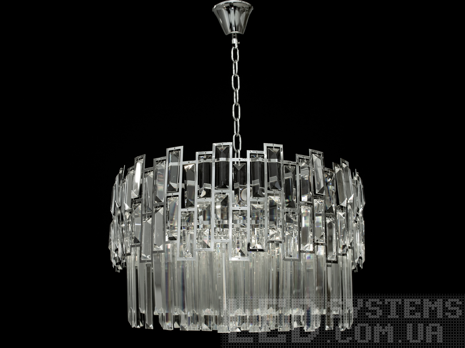 Сучасна кришталева люстра-підвіс у спальню на 9 ламп застосовується у квартири, будинки, для вітальні чи спальні, банкетного чи концертного залу, ресторану чи готелю.

Люстра ідеально підійде для невеликих кімнат і навіть для низьких стель.

Кришталева люстра під лампу розжарювання, економку або світлодіодну з цоколем Е14. Стельове кріплення на планку універсальне та підходить для навісних, натяжних та звичайних стель.

Увага. Вага люстри понад 10 кг.