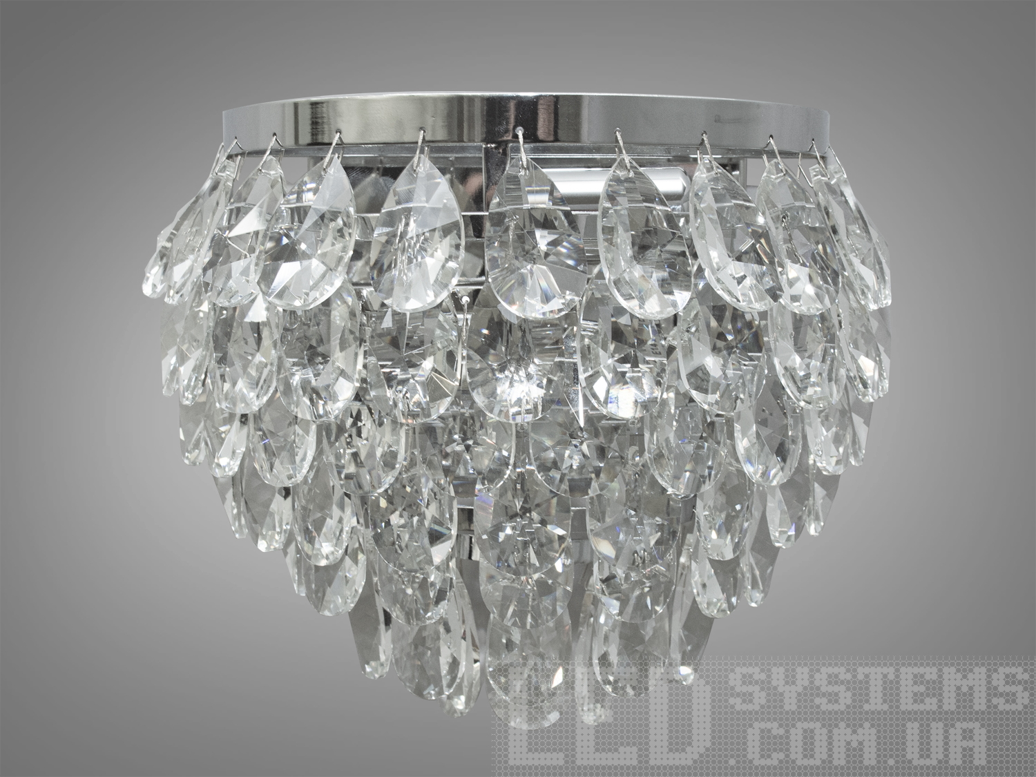 Бра з кришталю в класичному стилі з кришталевими підвісками, з металевим корпусом добре виглядатиме в інтер'єрі спальні, зали, їдальні, коридору. Блиск та переливи справжнього кришталю зачаровують. Нові настінні світильники виконані в класичному стилі та розраховані на 2 лампи з цоколем Е14. Універсальне кріплення на планку підходить для будь-якого типу стін.