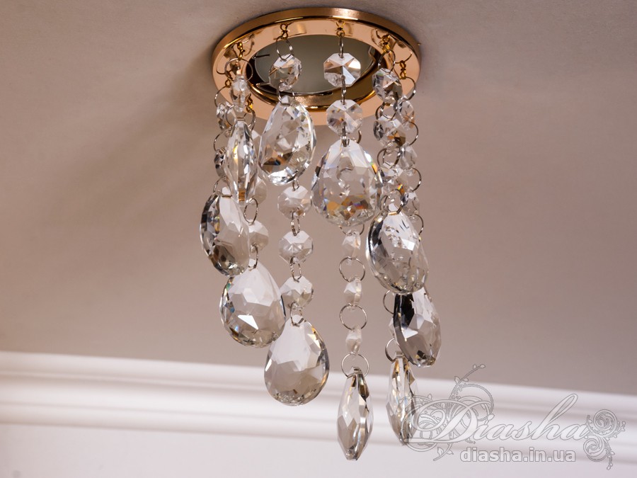 Бездоганна елегантність цього точкового світильника, поєднана з сяючим блиском високоякісного кришталю принесе Вам чимало приємних хвилин. 
Наприклад, Ви зможете доповнити інтер'єр з люстрою серії 