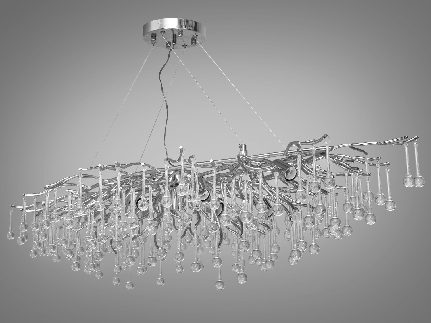 Елегантна кришталева люстра витягнутої форми для кухні також застосовується для вітальні, зали, спальні, коридору або для холу, гармонійно вписуючись в будь-який сучасний інтер'єр.
Особливість витягнутої форми цієї кришталевої люстри робить її не тільки унікальною, але й багатофункціональним вибором. Така її конструкція дозволяє створити безперервний візуальний потік світла, що робить її ідеальним вибором для просторів, де потрібно підкреслити лінійність простору, наприклад, над довгим обіднім столом або в просторій вітальні.
Конструкція люстри починається з простої, але елегантної алюмінієвої основи, що кріпиться до стелі. Звідси розгалужуються тонкі, майже невагомі алюмінієві гілки, розкидані хаотично, як гілки дерева в зимовому саду. Кожна гілка прикрашена кришталевими підвісками у формі краплі, що нагадують сльози принца Руперта, відомі як 