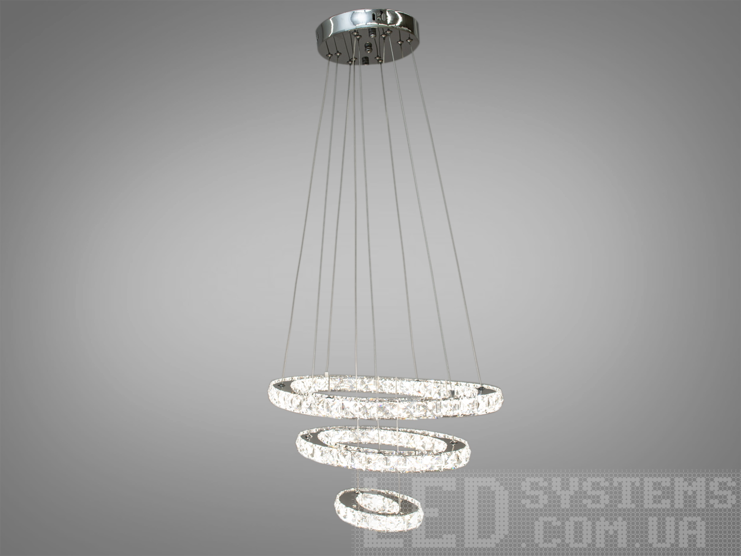 Кришталева світлодіодна люстра-підвіс для невеликих приміщень укомплектована світлодіодними лампами потужністю 56 Вт. Що дозволяє висвітлити 7-9 кв.м навіть без встановлення додаткових врізних світильників. У комплекті з люстрою йде найсучасніший пульт-вимикач, кожне натискання на який перемикає люстру. З пульта можна включити один із встановлених режимів освітлення - тепле світло, холодне світло, нейтральне. Застосовується для холу, зали, вітальні, сходових отворів. Кріпиться до натяжних, навісних та звичайних стель.