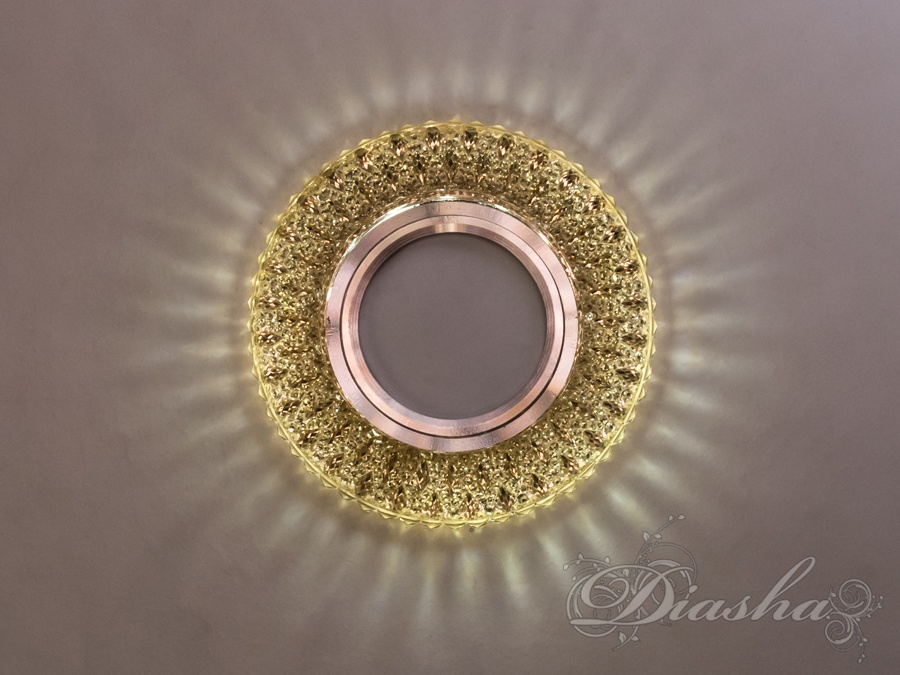 Точкові світильники зі світлодіодним підсвічуванням справжній хіт нашого часу, до звичного висвітлення за допомогою ламп MR-16 додана світлодіодне підсвічування, потужністю 3Вт. Ви можете включати як окремо лампу або підсвічування, так і разом.
Врізка виконана з акрилової смоли, яка не поступається за своїми декоративними властивостями кришталю - на стелі ви побачите красиві промінчики світла.
Точкові світильники з led підсвічуванням широко застосовуються практично в будь-яких приміщеннях - вітальнях, спальнях, кухнях, коридорах і навіть у ванній кімнаті.
Лампа і трансформатор в комплект не входять.