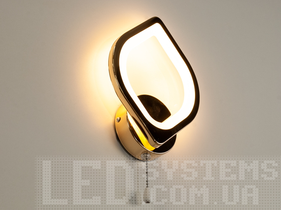 Світлодіодне бра у спальню виконане у сучасному стилі. Застосовується для читання та освітлення.
За допомогою вимикача є можливість зміни температури світла: холодний 6400К, нейтральний 4500К, теплий 2700К, а також включення-вимикання відбувається шнурком на самому бра.
Кріпиться до стіни, до гіпсокартону або до інших настінних поверхонь.