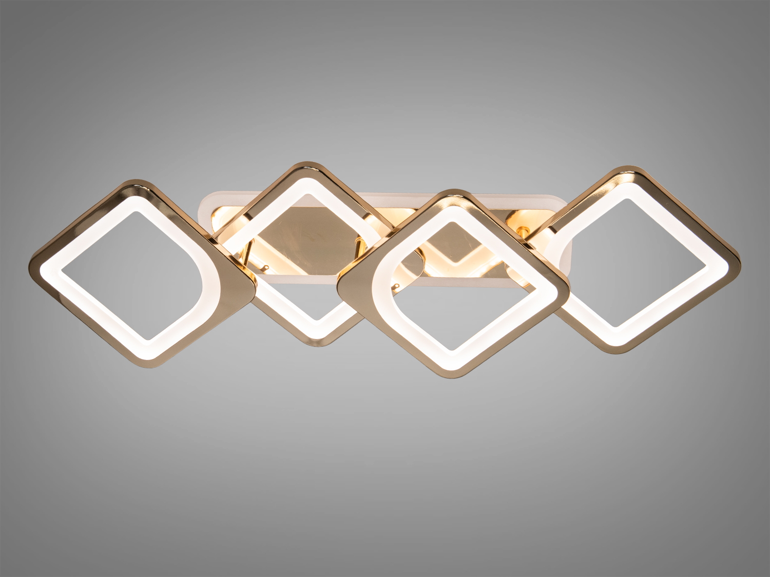 Витягнута LED люстра на кухню з підсвічуванням – це стильне втілення геометричної гармонії та сучасного освітлення. Її витягнута композиція, що складається з чотирьох квадратів, створює ефект легкості та легкості, а позолочений металевий каркас надає люстрі благородства та розкіш.