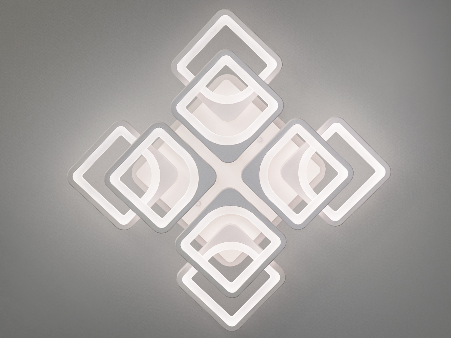 Квадратна LED люстра в стилі хай-тек з підсвічуванням, з пультом, з димером підходить на площу приміщення приблизно 23кв.м. Застосовується для залу, вітальні, кухні, спальні, їдальні, дитячої, тому що відсутні елементи, що б&prime;ються.
Світлодіодна люстра має кілька режимів: холодний 6000К, нейтральний 4100К, теплий 3200К, кольорове підсвічування, суміщений режим &ndash; будь-яке основне світло плюс будь-який колір світлодіодного підсвічування. Регулювання яскравості люстри від 5 до 100% відбувається за допомогою пульта дистанційного керування, що входить до комплекту.
Люстра світить яскраво, але не сліпить за рахунок матеріалу &ndash; акрилу, до того ж цей матеріал дуже міцний &ndash; його важко зашкодити. Кріпиться до стелі будь-якого типу універсальним кріпленням на монтажну планку.