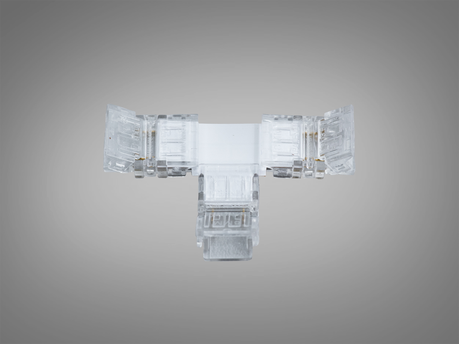 T‑подібний прозорий конектор 8 мм на 2 контакти для SMD і COB стрічок. Пробивний контакт, монтаж без пайки, майже безшовний стик у Т‑конфігурації.