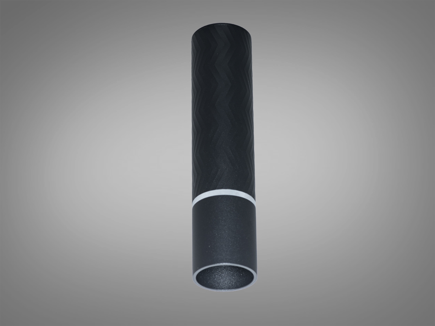 Чорний накладний циліндричний світильник під лампу GU10. Текстурована поверхня, спрямоване світло, лампа не входить у комплект.