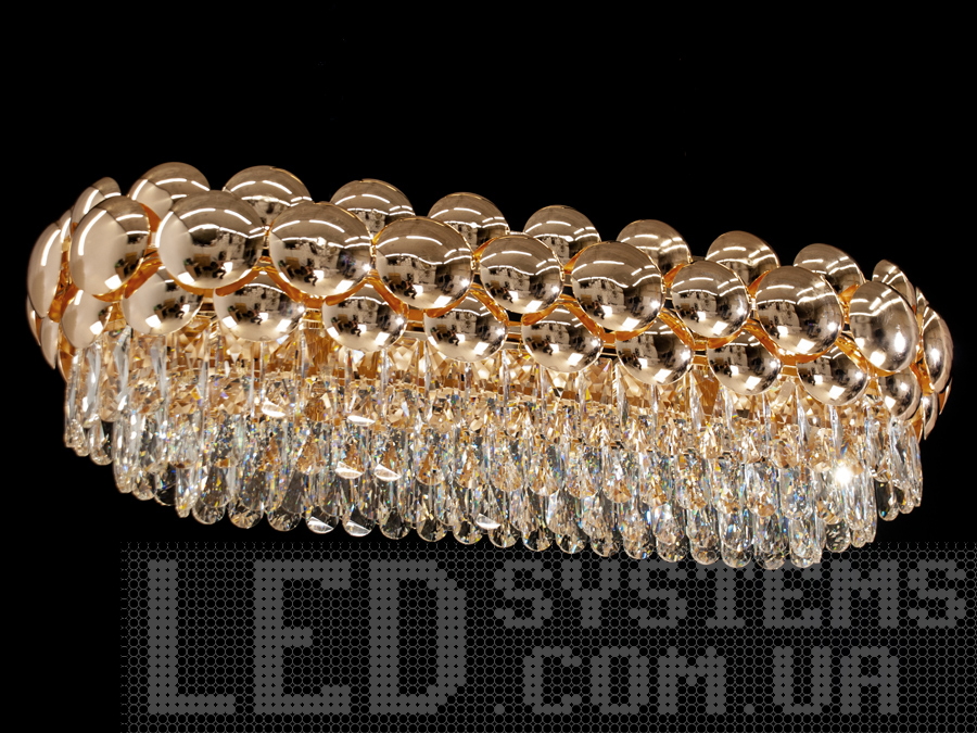 Сучасна кришталева люстра овальної форми для їдальні, вітальні, залу, підходить також для довгастих кімнат. Пропорції овальних люстр ідеально гармоніюють з великими обідніми столами.&nbsp;Люстра спеціально розрахована так, що максимум яскравого світла потрапить на стіл, а інший простір приміщення наповниться м'яким світлом розсіяний кришталевими підвісками.&nbsp;Стельове кріплення на планку універсальне і підходить для навісних, натяжних і звичайних стель. Люстра-подвес під звичайні лампочки розжарювання, економки, або світлодіодні лампи з цоколем Е14.&nbsp;
Увага. Вага люстри більше 10кг.