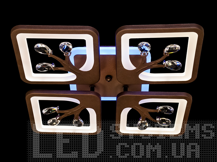 ЛЕД люстра в стилі модерн для залу з пультом, з LED підсвічуванням, з димером підходить на площу приміщення приблизно 12кв.м. Застосовується для зали, вітальні, спальні, кухні, коридору, дитячої, оскільки відсутні скляні елементи.
Світлодіодна люстра має кілька режимів: холодний 6000К, нейтральний 4100К, теплий 3200К, включення-вимикання, кольорове підсвічування, змішаний режим. Люстра має електронний димер, що дозволяє регулювати яскравість люстри від 5% до 100% за допомогою пульта, що входить до комплекту.
Кріпиться до стелі будь-якого типу універсальним кріпленням на монтажну планку.